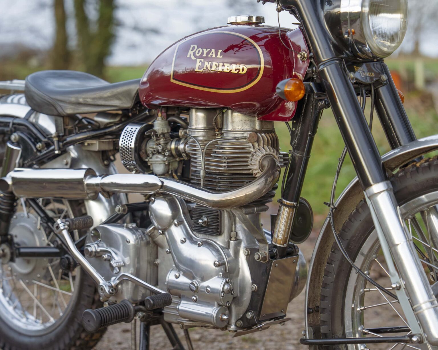 Royal Enfield Classic motorcycle with vintage design and chrome details.