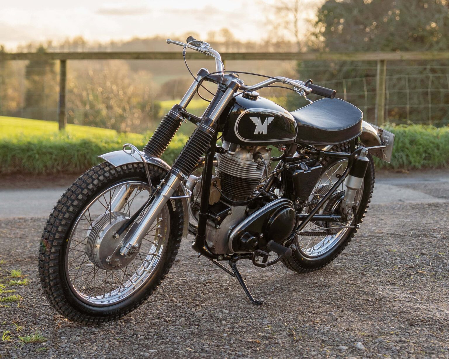 Classic vintage motorcycle with black paint, chrome details, and retro styling.