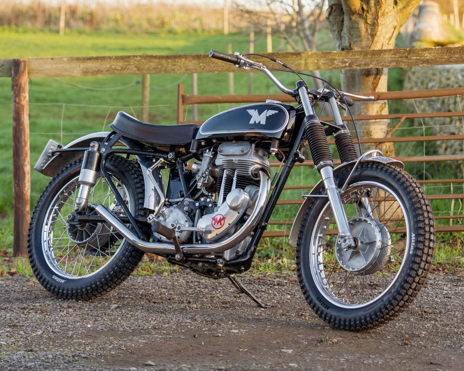High-resolution vintage motocross motorcycle with classic design and off-road tyres. Perfect for classic motorcycle enthusiasts.