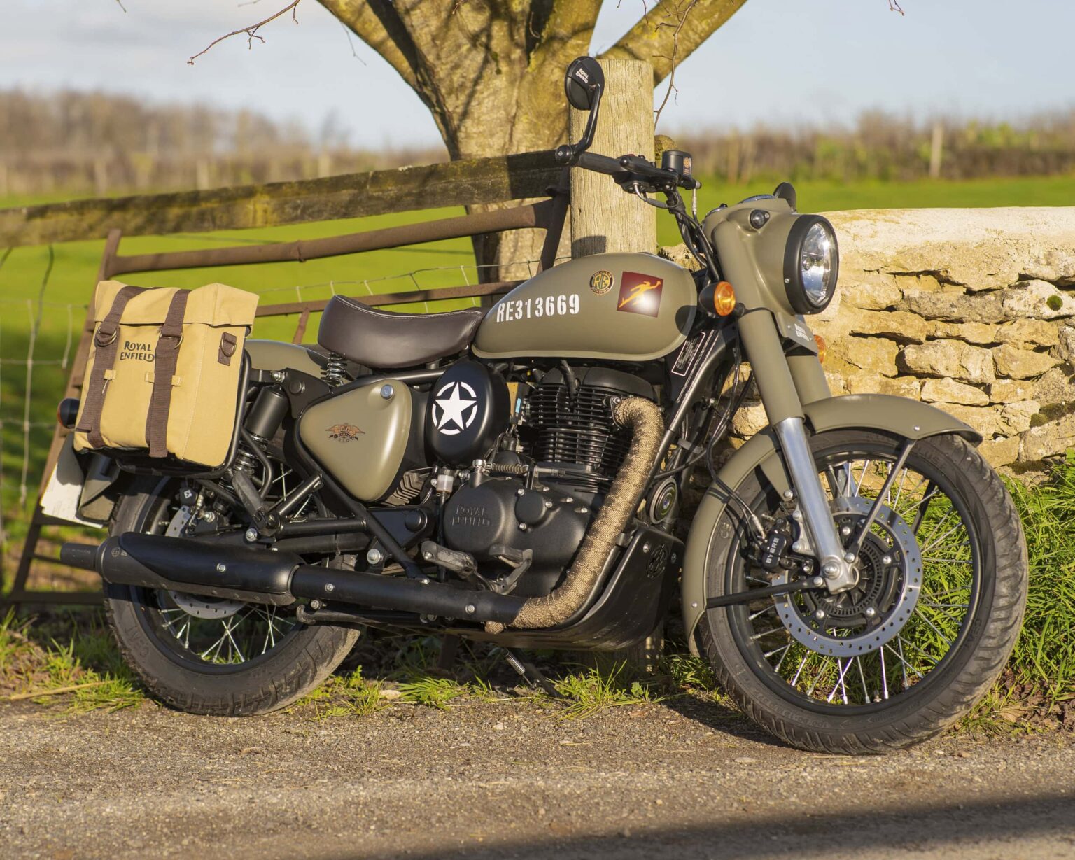 Military-style motorcycle with vintage design and accessories.