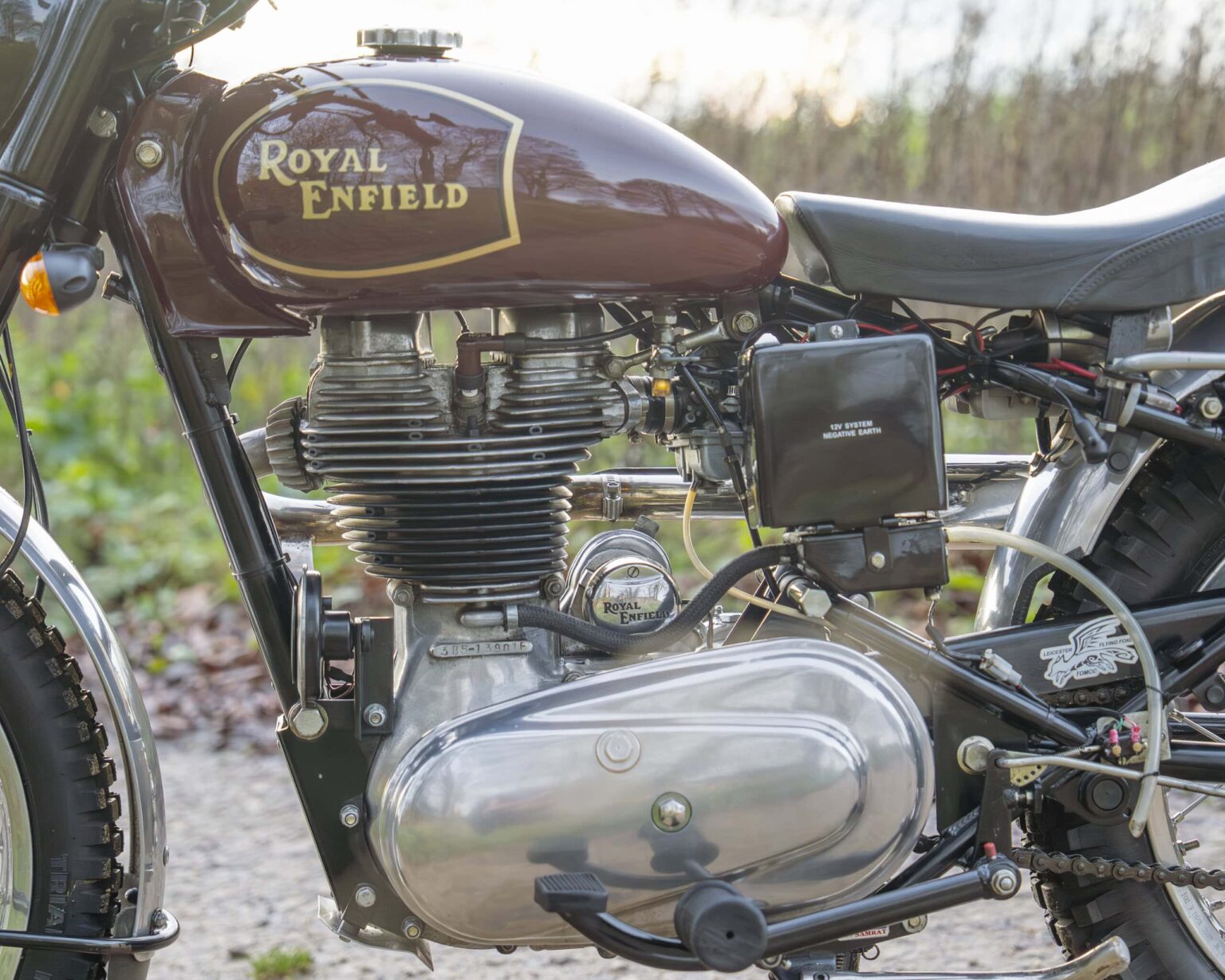 Vintage Royal Enfield motorcycle with a classic design and engine details.