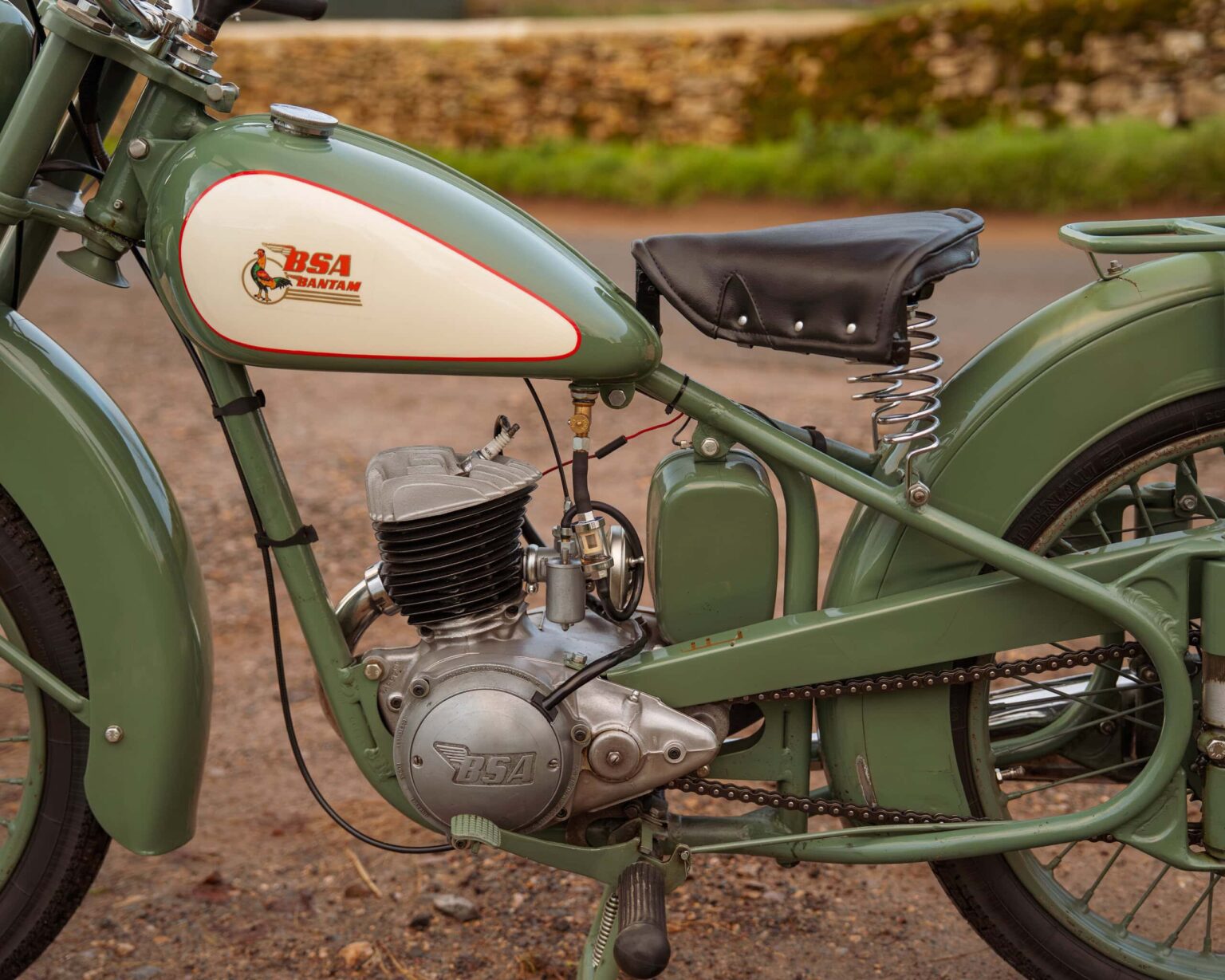 BSA vintage motorcycle with green paint and classic design.
