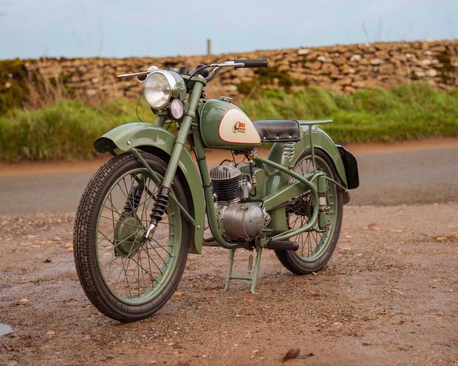 Vintage green motorcycle for classic vehicle enthusiasts.
