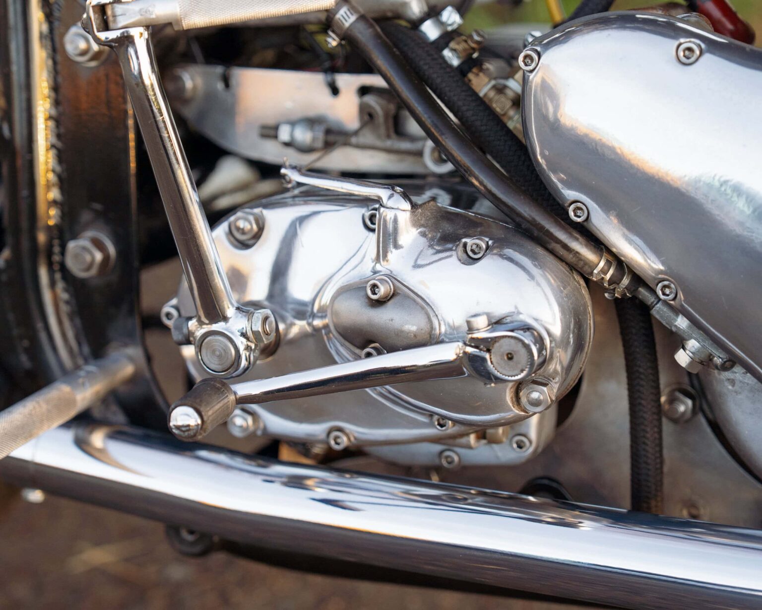 Classic motorcycle engine showcasing polished metal and mechanical components.