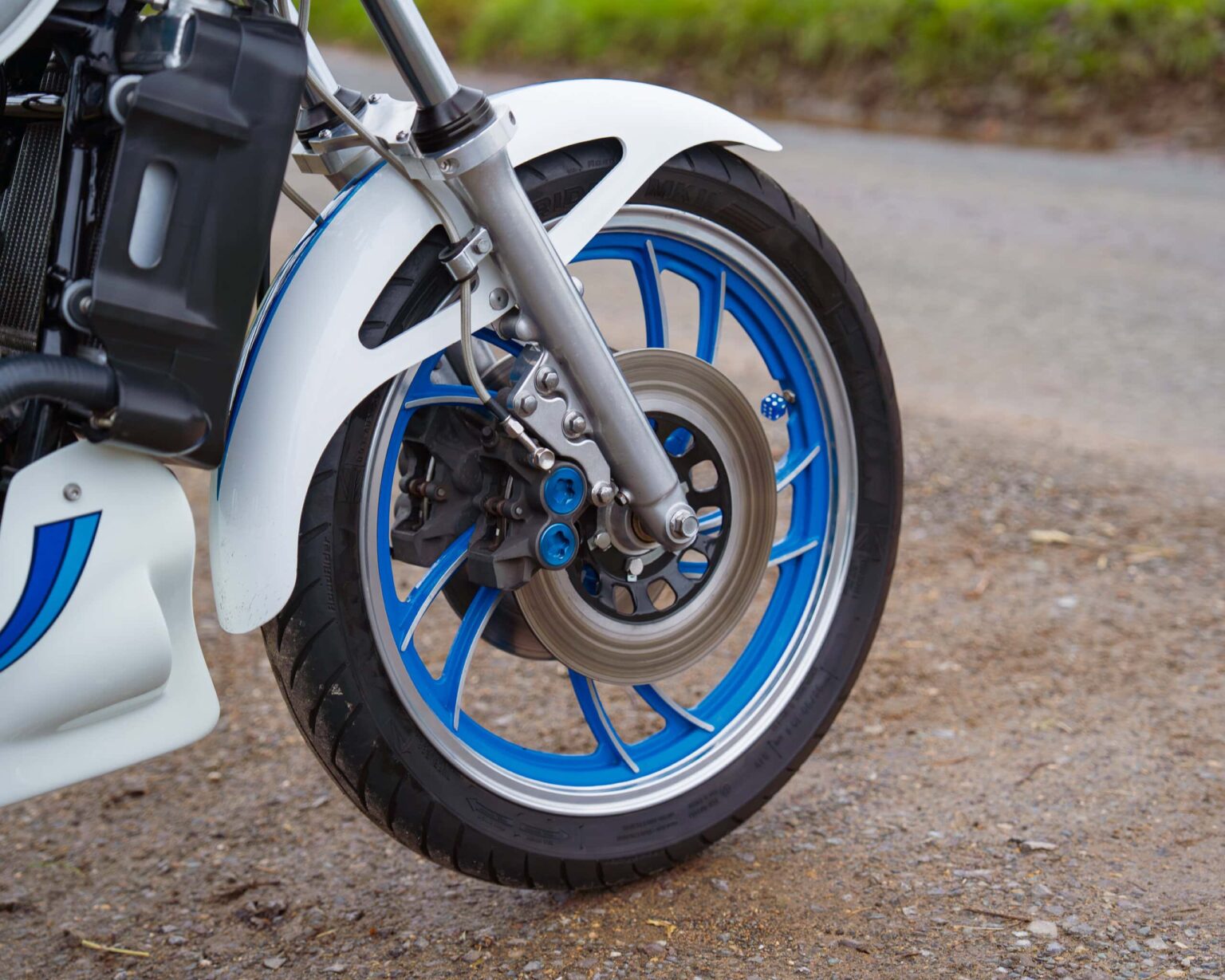 High-performance racing motorcycle with blue and white details.