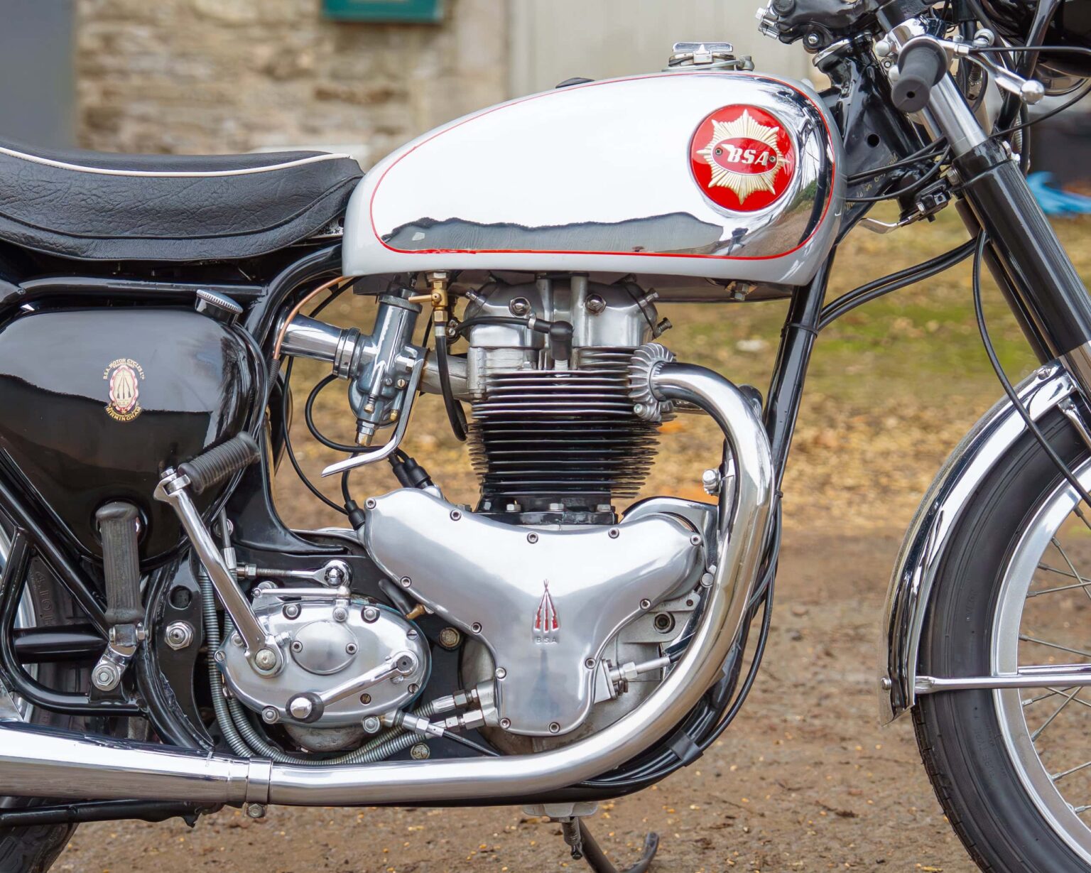 Classic British motorcycle engine with BSA logo, chrome parts, and black frame, vintage style.