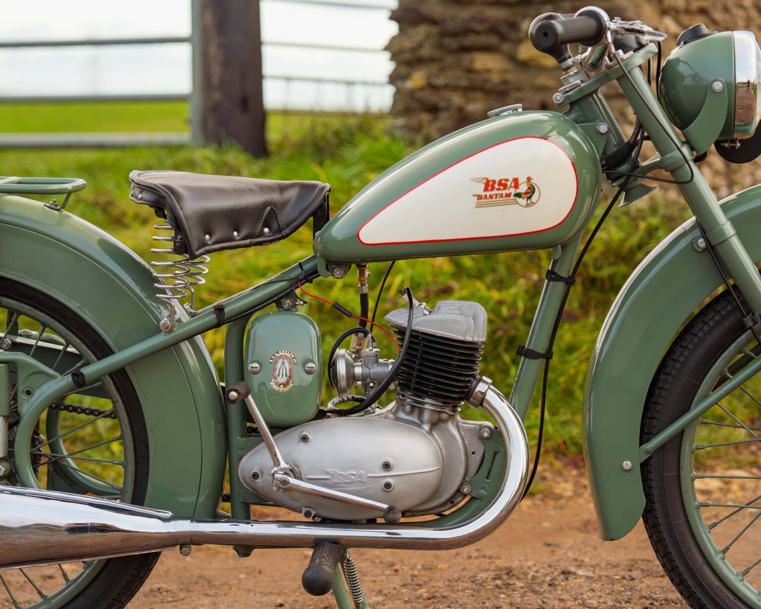 Vintage BSA motorcycle with green and cream paintwork.