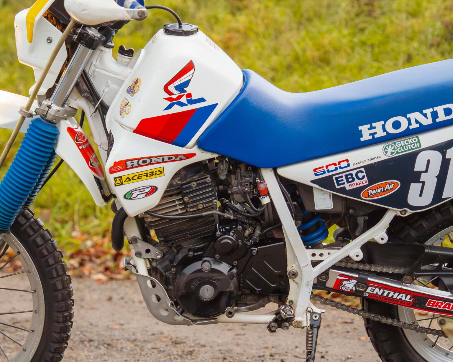 Honda CR500 motocross bike with vintage decals and racing setup.