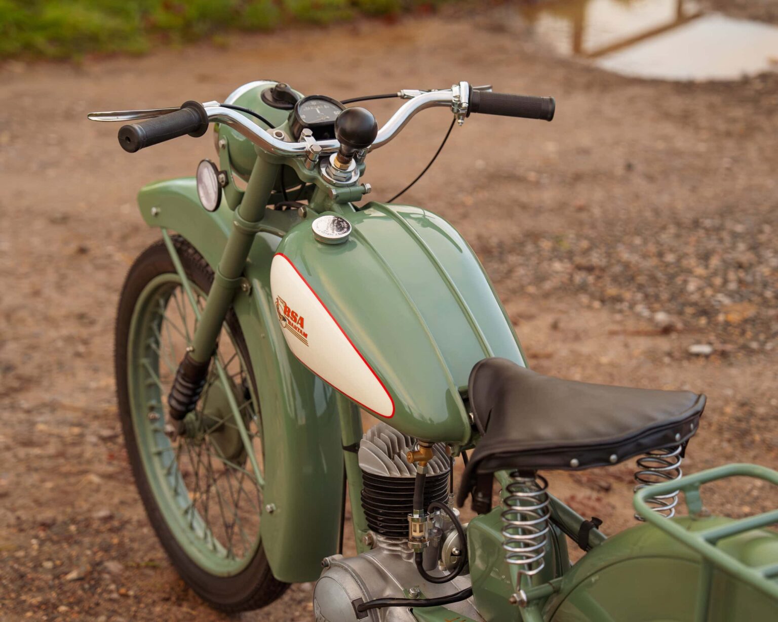 Vintage motorcycle with sidecar, ideal for classic vehicle competitions.