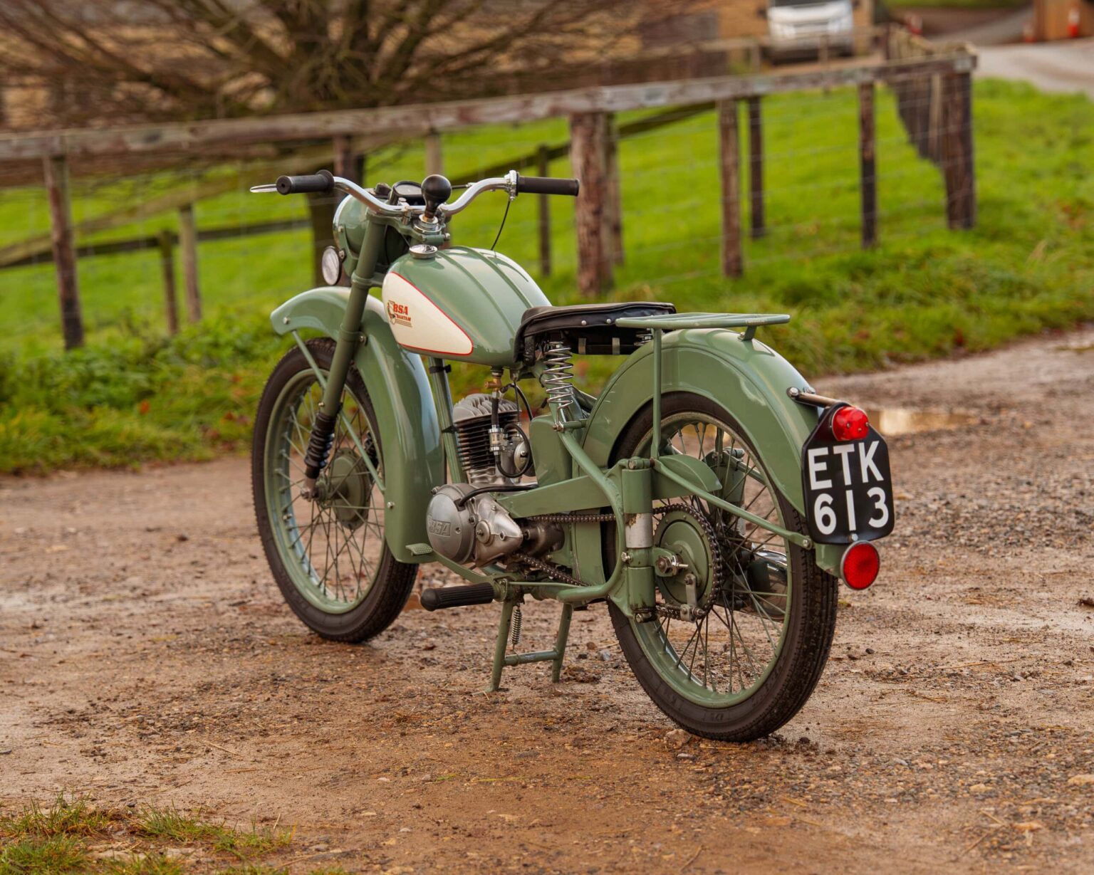Classic vintage motorcycle with a green finish and retro design.