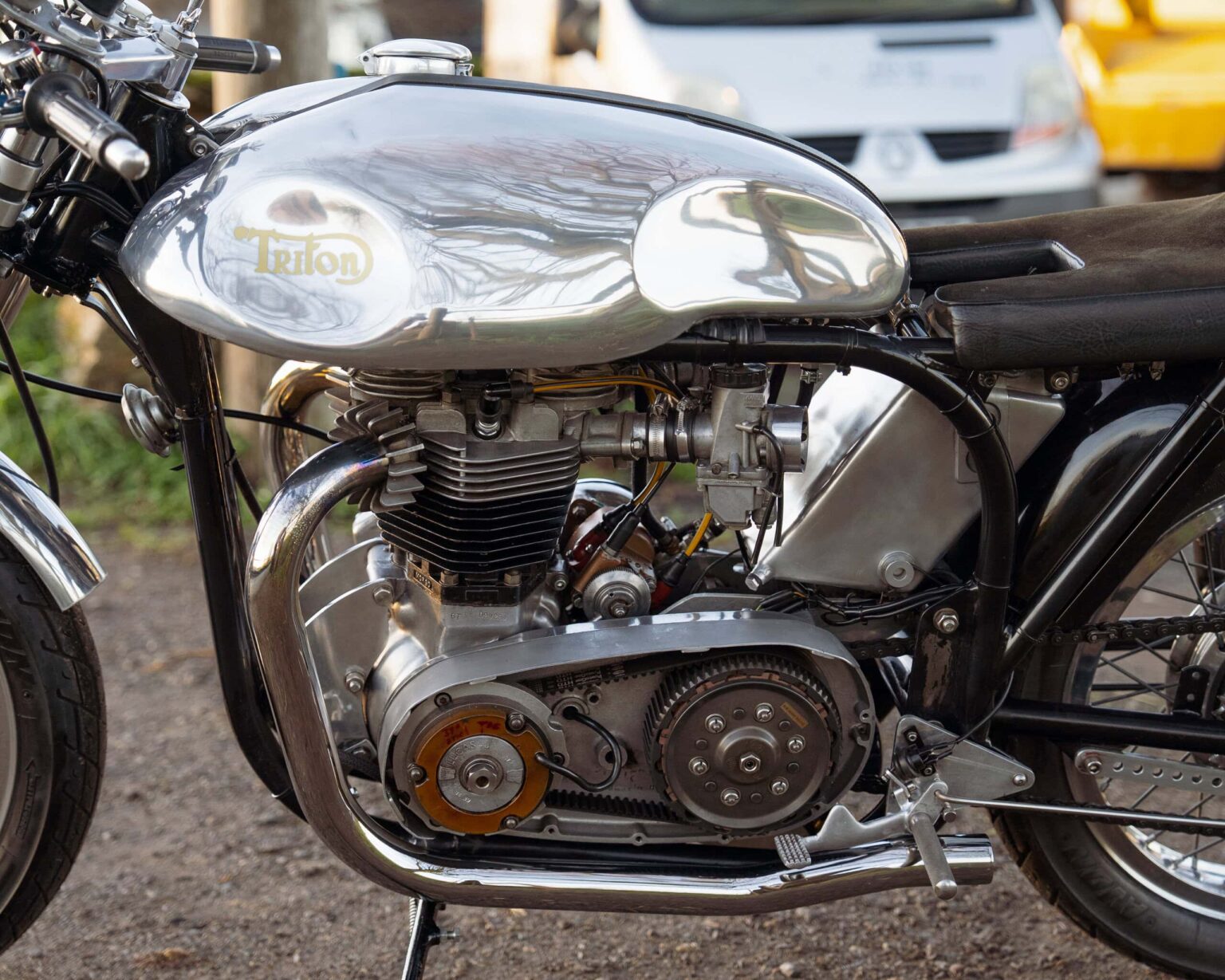 Close-up of a vintage Triumph motorcycle engine showcasing classic design and engineering excellence.
