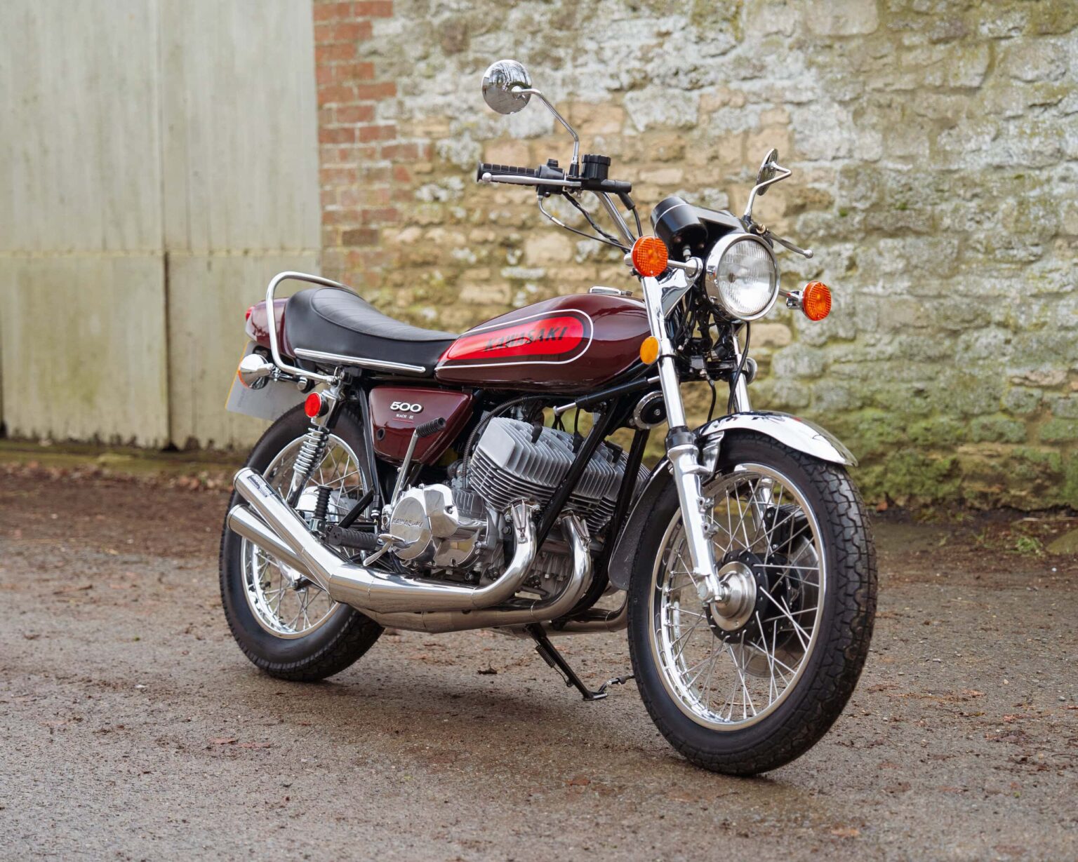Motorcycle with vintage design and red and black colour scheme.