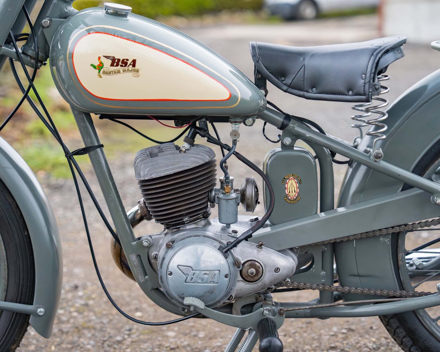 Classic BSA motorcycle engine with vintage frame and seat.
