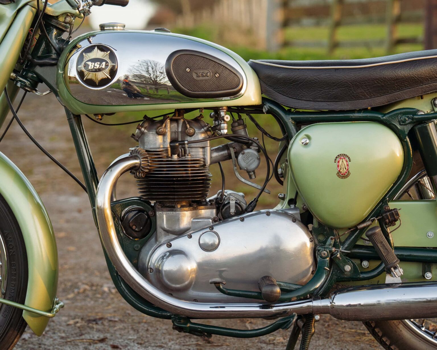 Vintage motorcycle engine with detailed components and retro design.