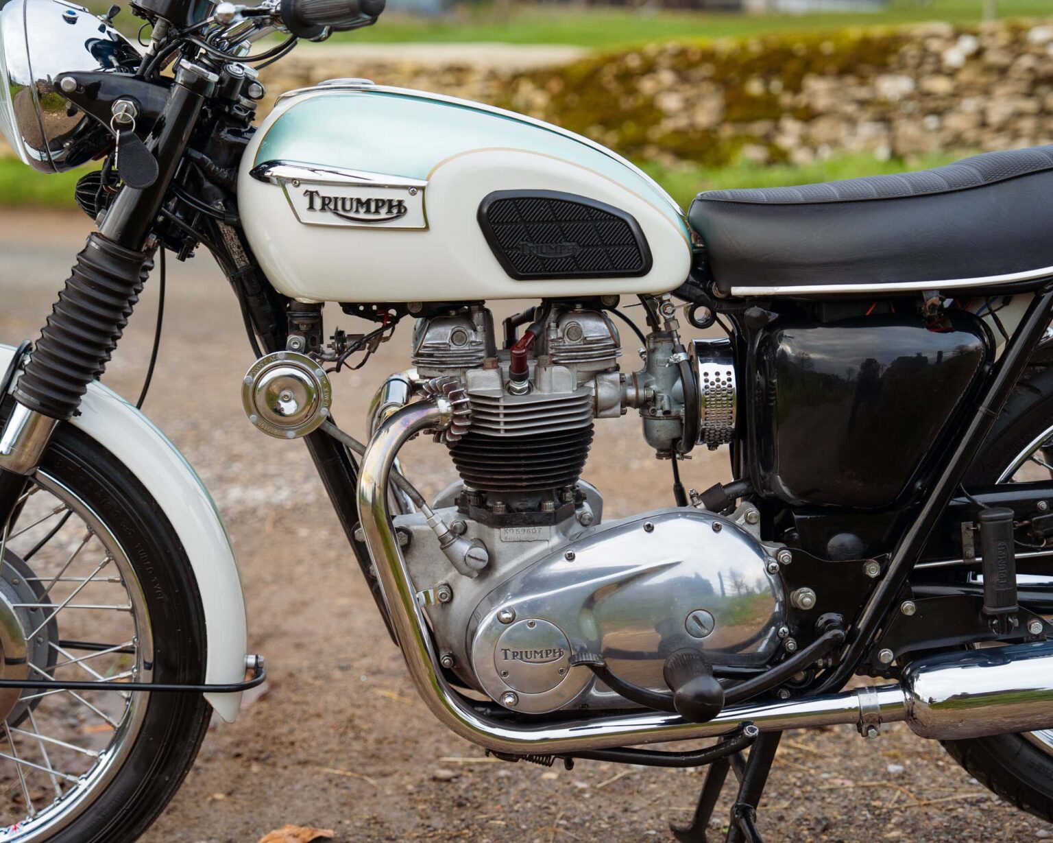 Vintage Triumph motorcycle with classic design and chrome details.