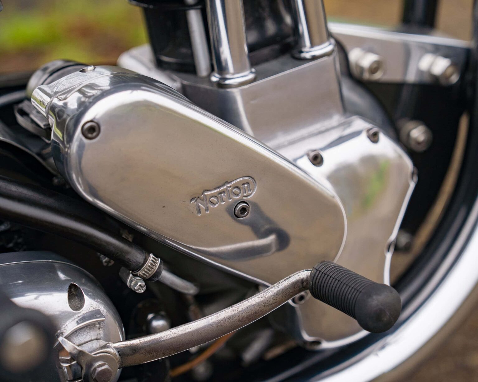 Close-up of a vintage motorcycle engine with detailed metal components.