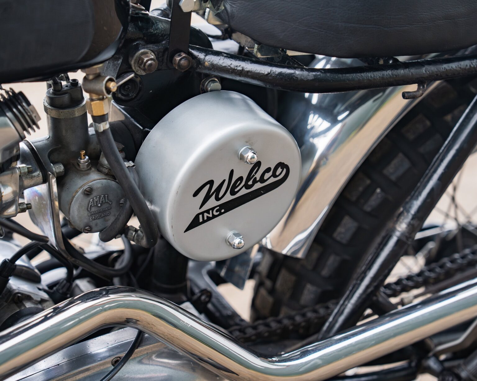 Close-up of a Welco motorcycle engine with detailed components.