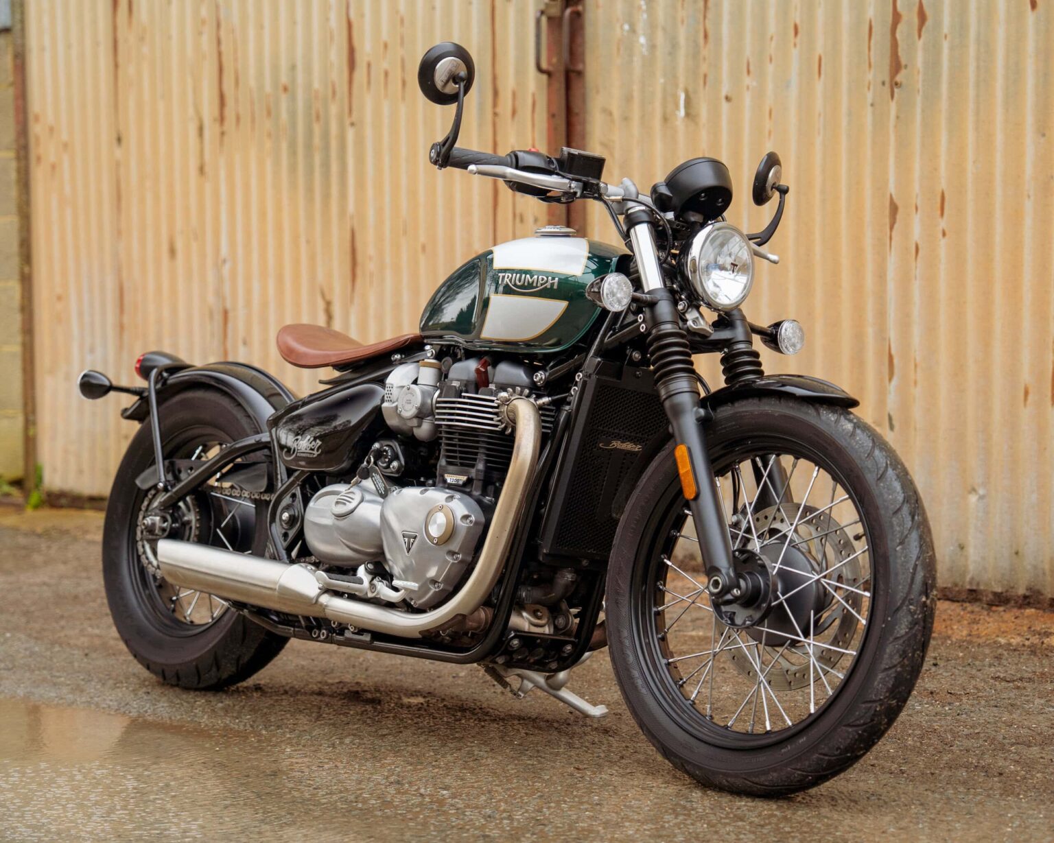 Classic Triumph Bonneville Bobber motorcycle parked outdoors.