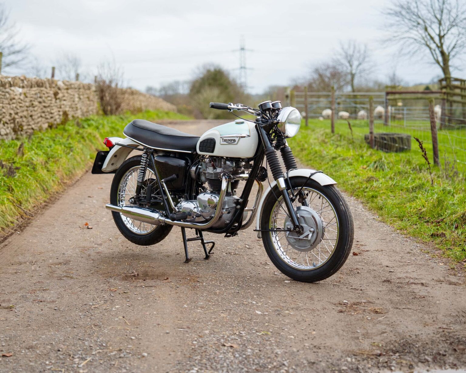 Classic motorcycle with retro design and white and black colour scheme.