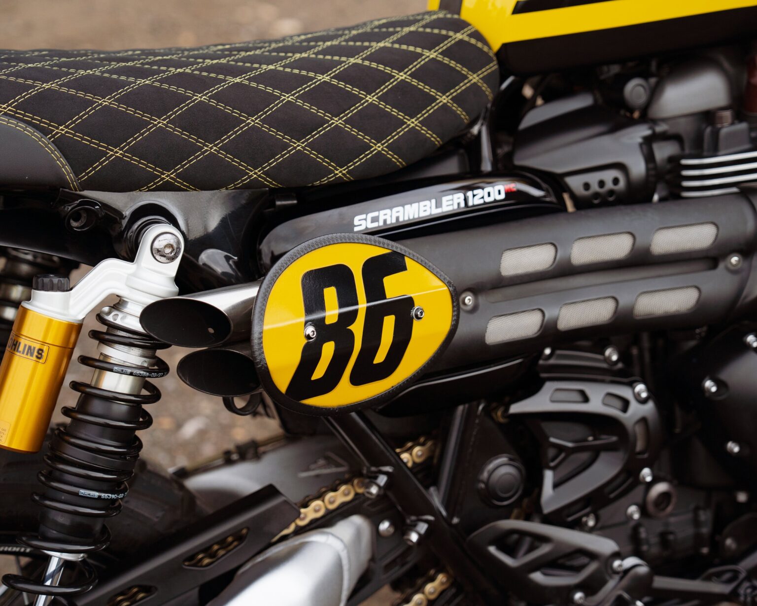 Customised classic motorcycle with BD logo and detailed seat design.