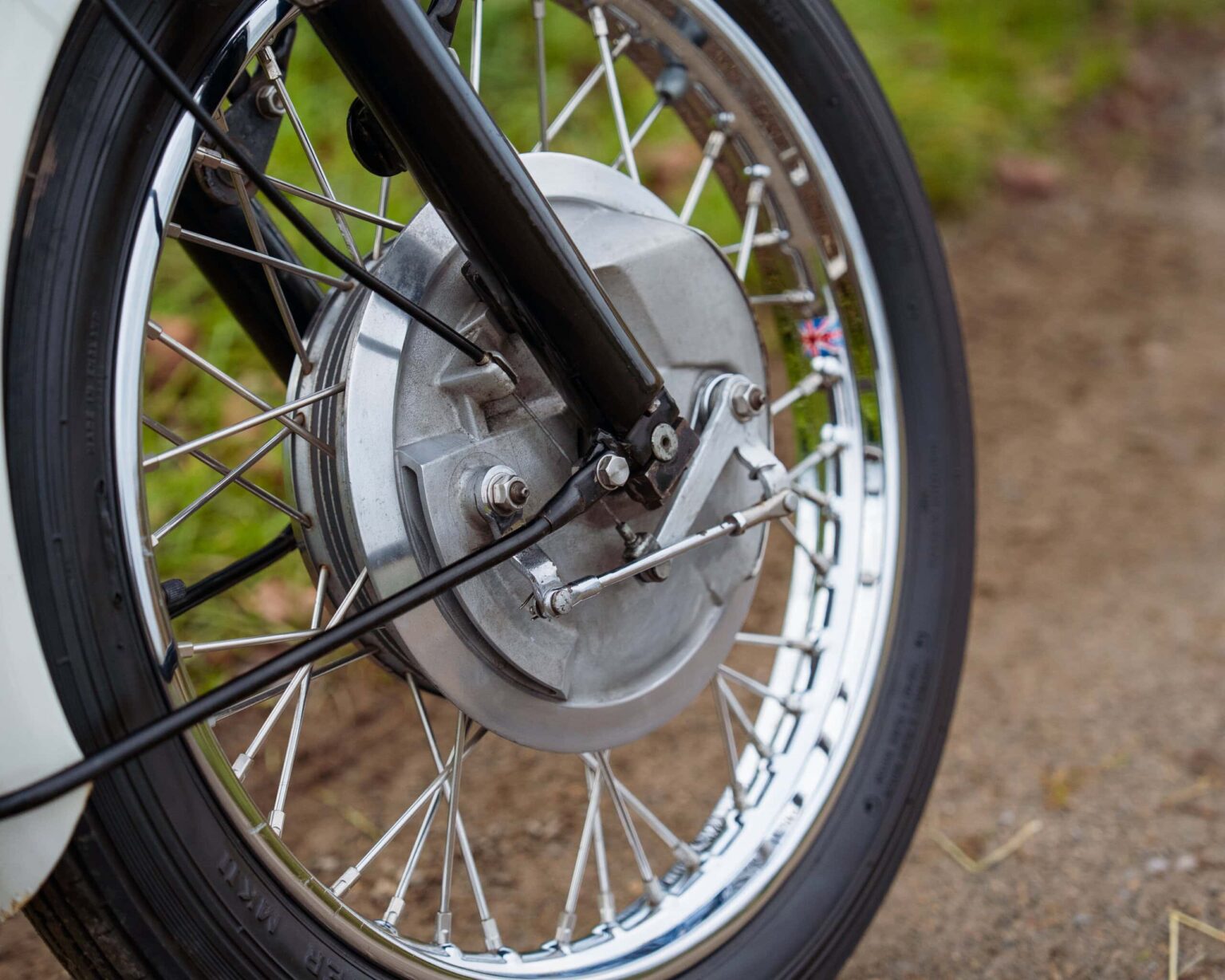 Electric motorcycle wheel with hub motor for sustainable transport.