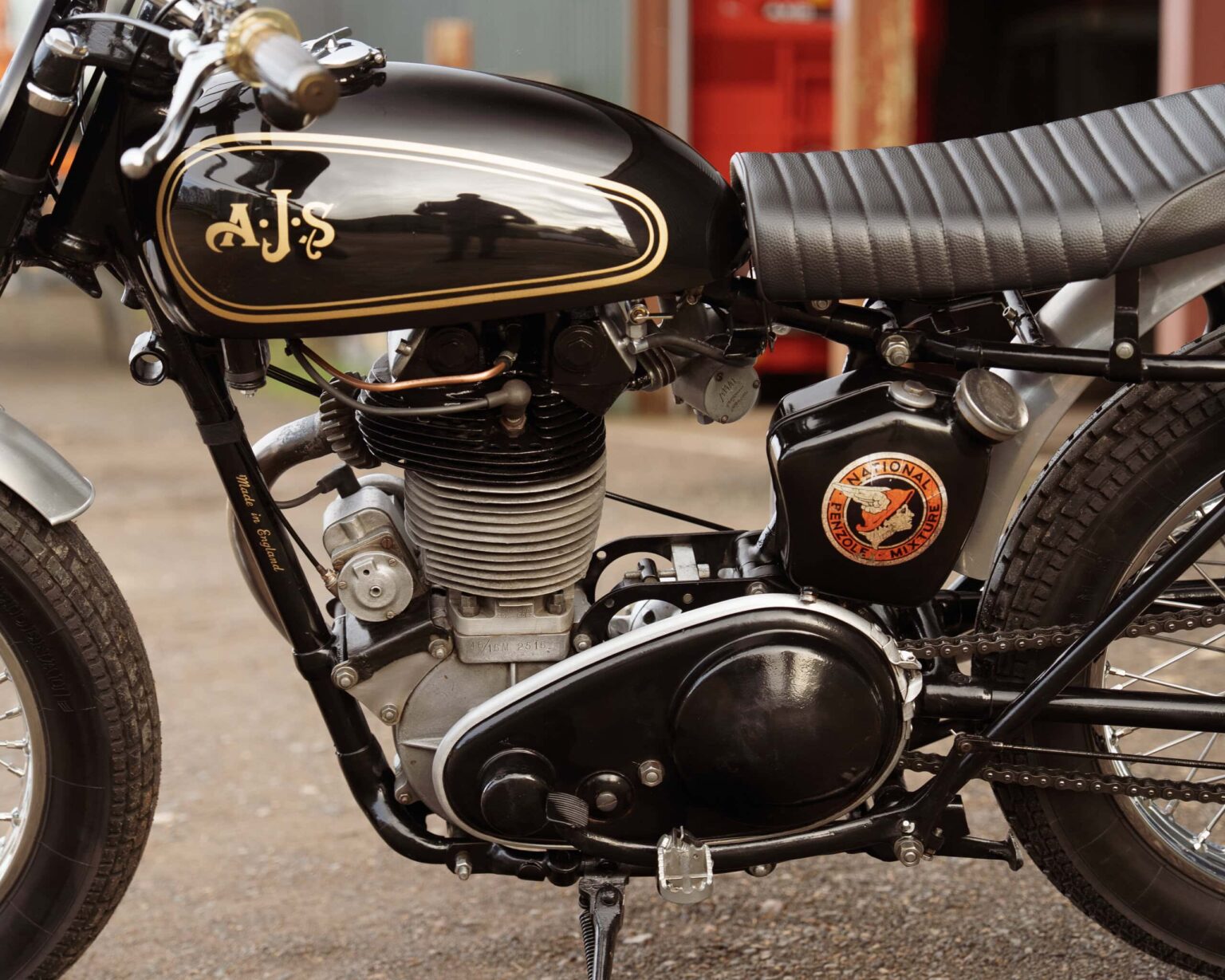 Vintage motorcycle engine with custom branding and black finish.