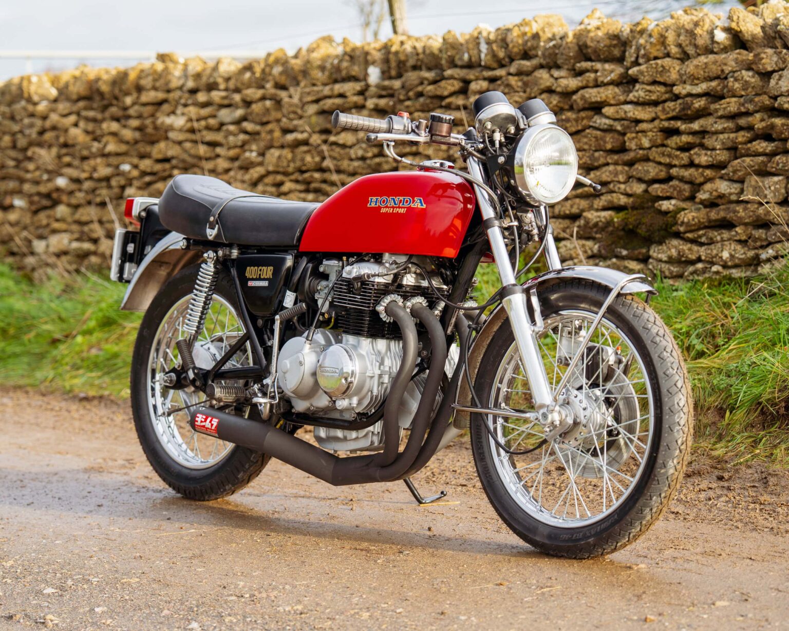 Vintage Honda CB750 motorcycle in red with black accents.
