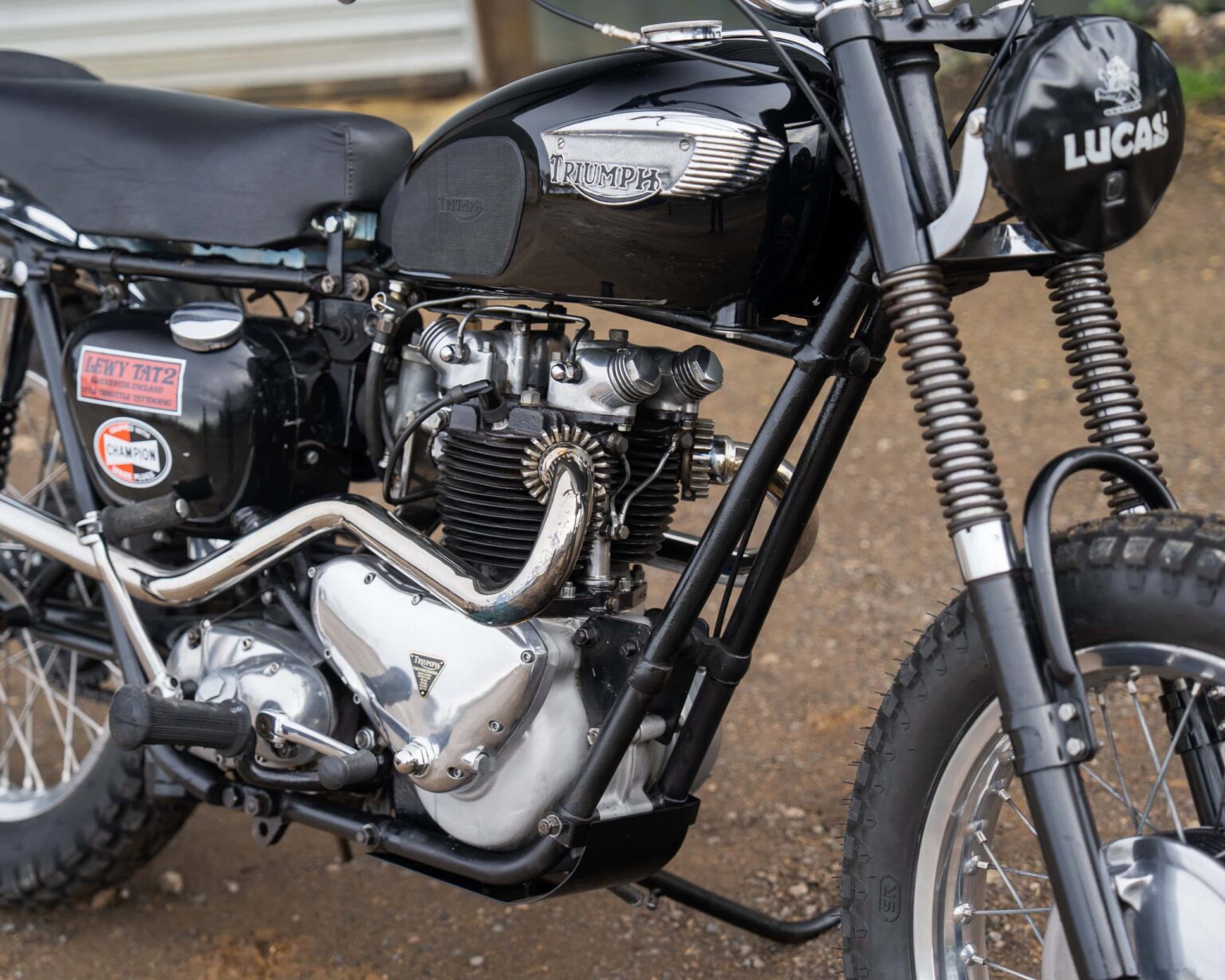 Triumph vintage motorcycle with black finish and retro design.