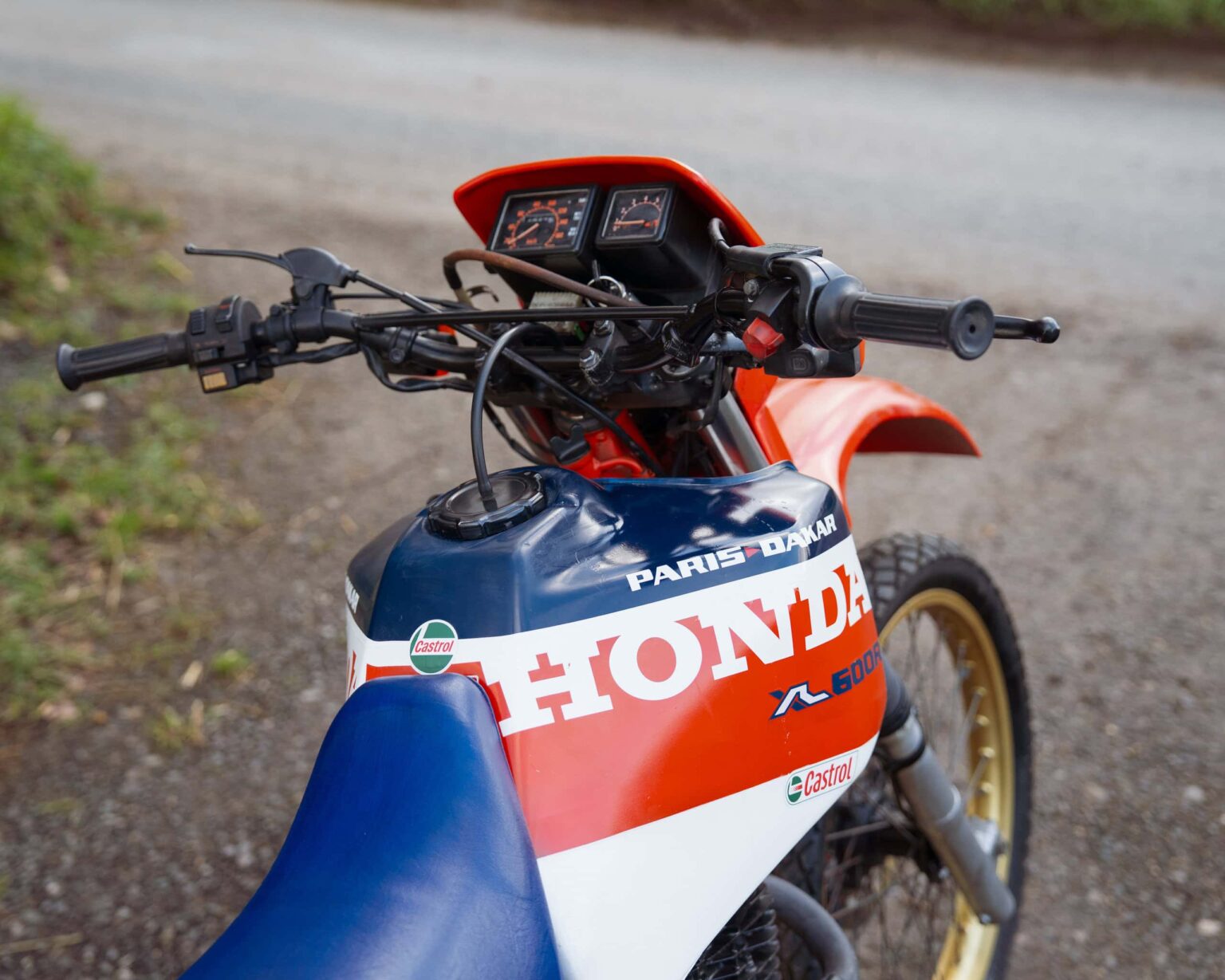 Honda motocross bike with vintage design and racing decals.