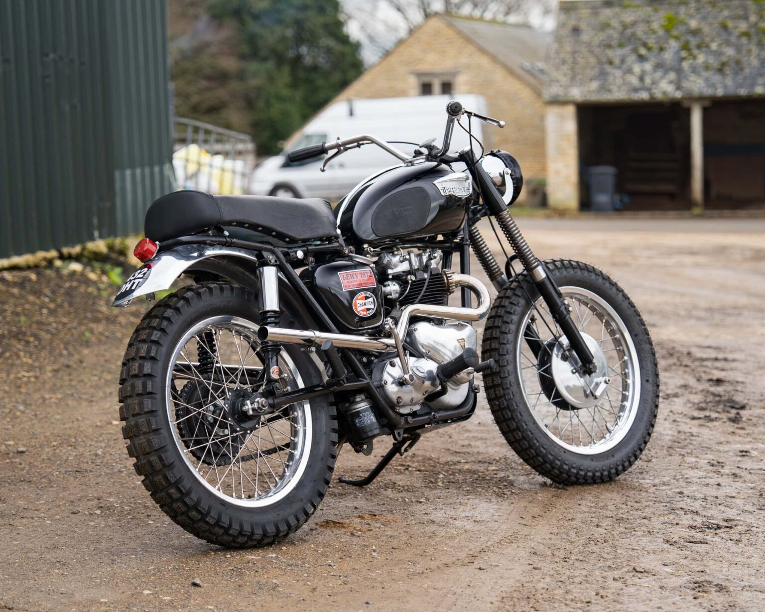 Vintage motorcycle with rugged tires and retro design.