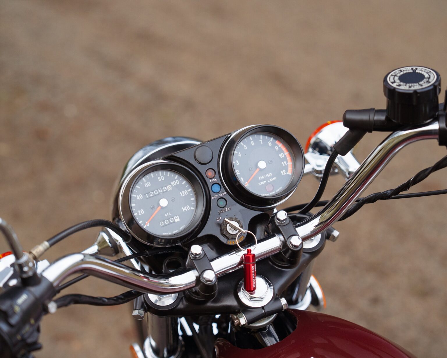 Motorcycle speedometer and tachometer on a vintage bike.