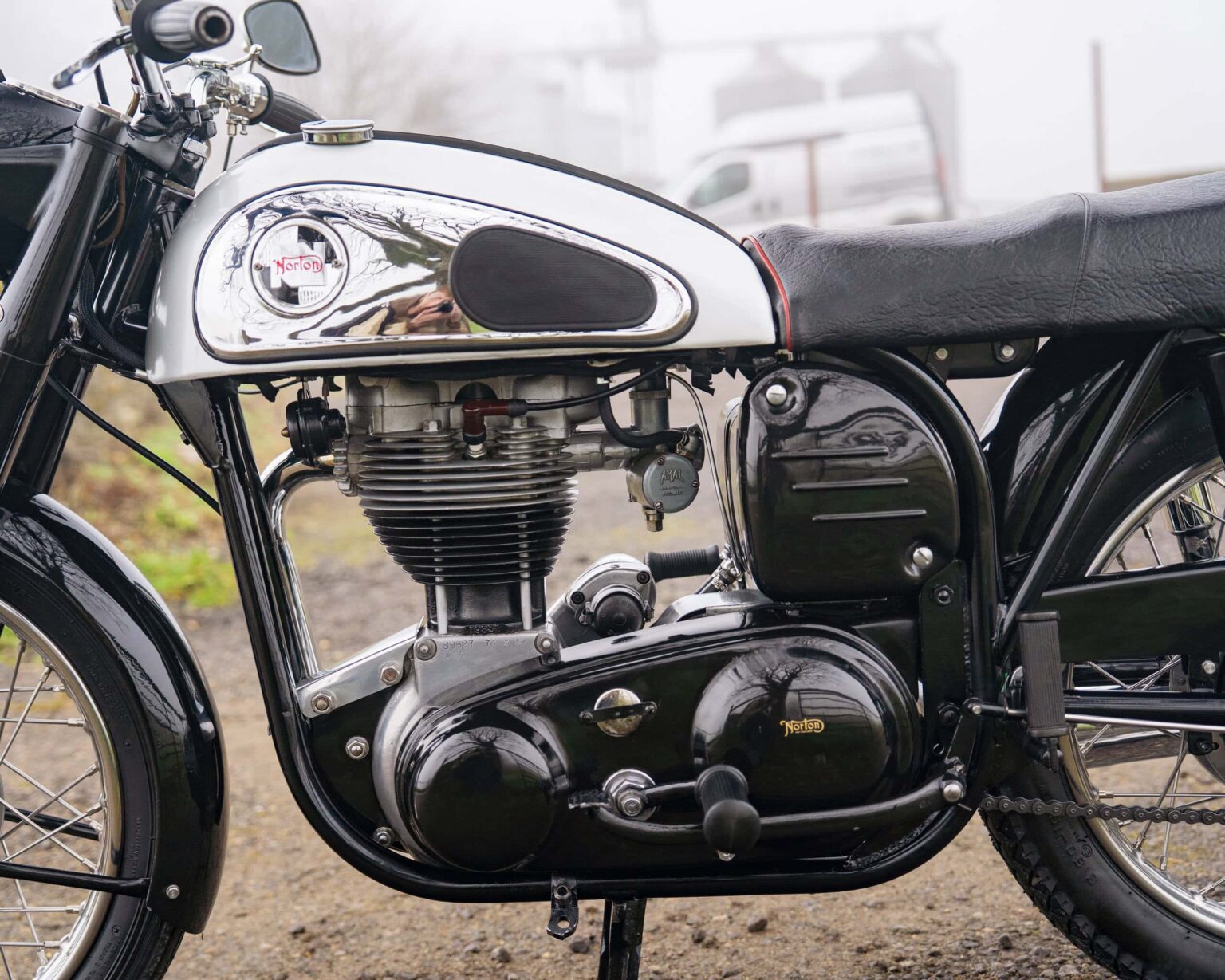 Vintage Norton motorcycle engine with chrome details and classic design.
