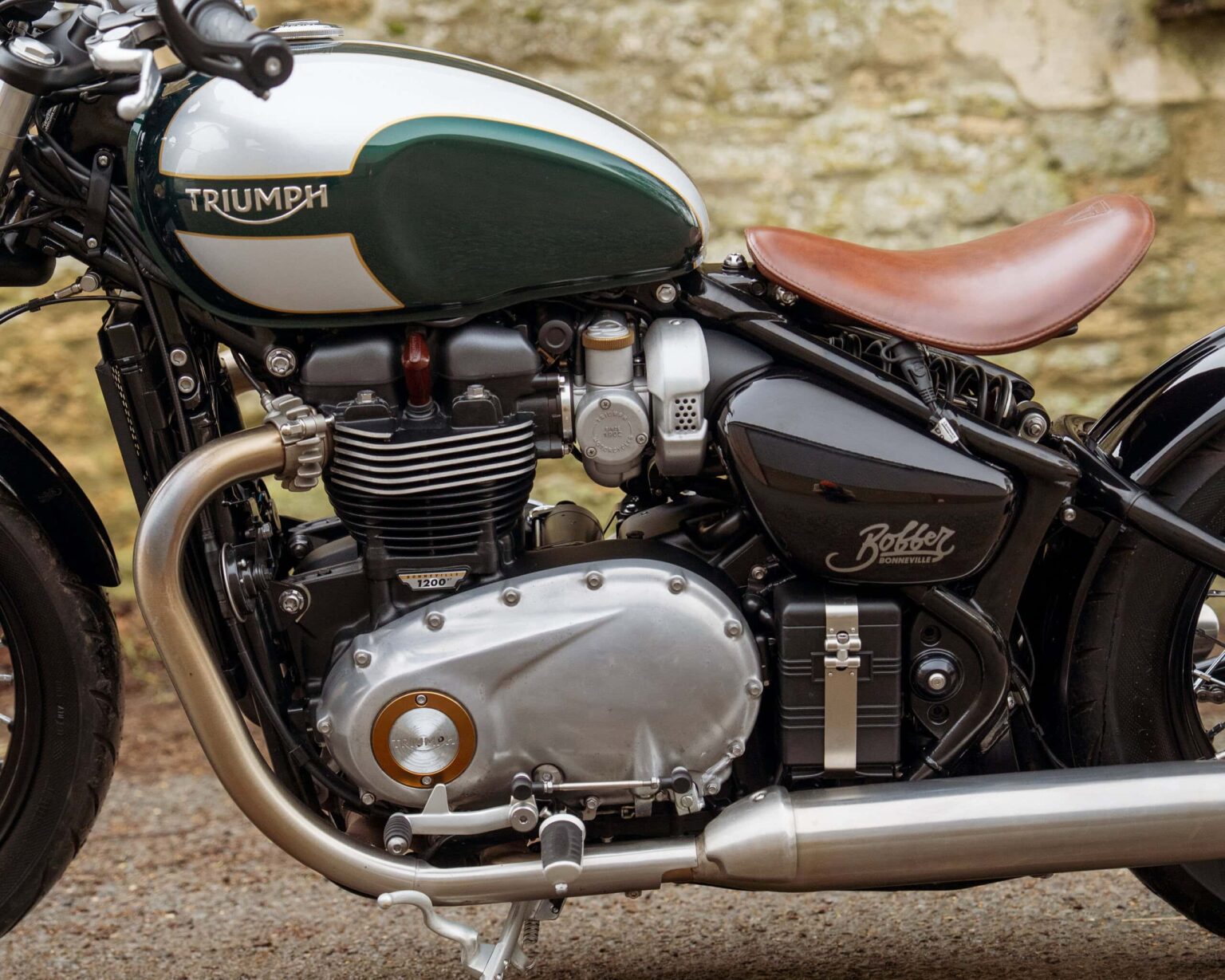 Classic Triumph Bonneville motorcycle with vintage design and leather seat.