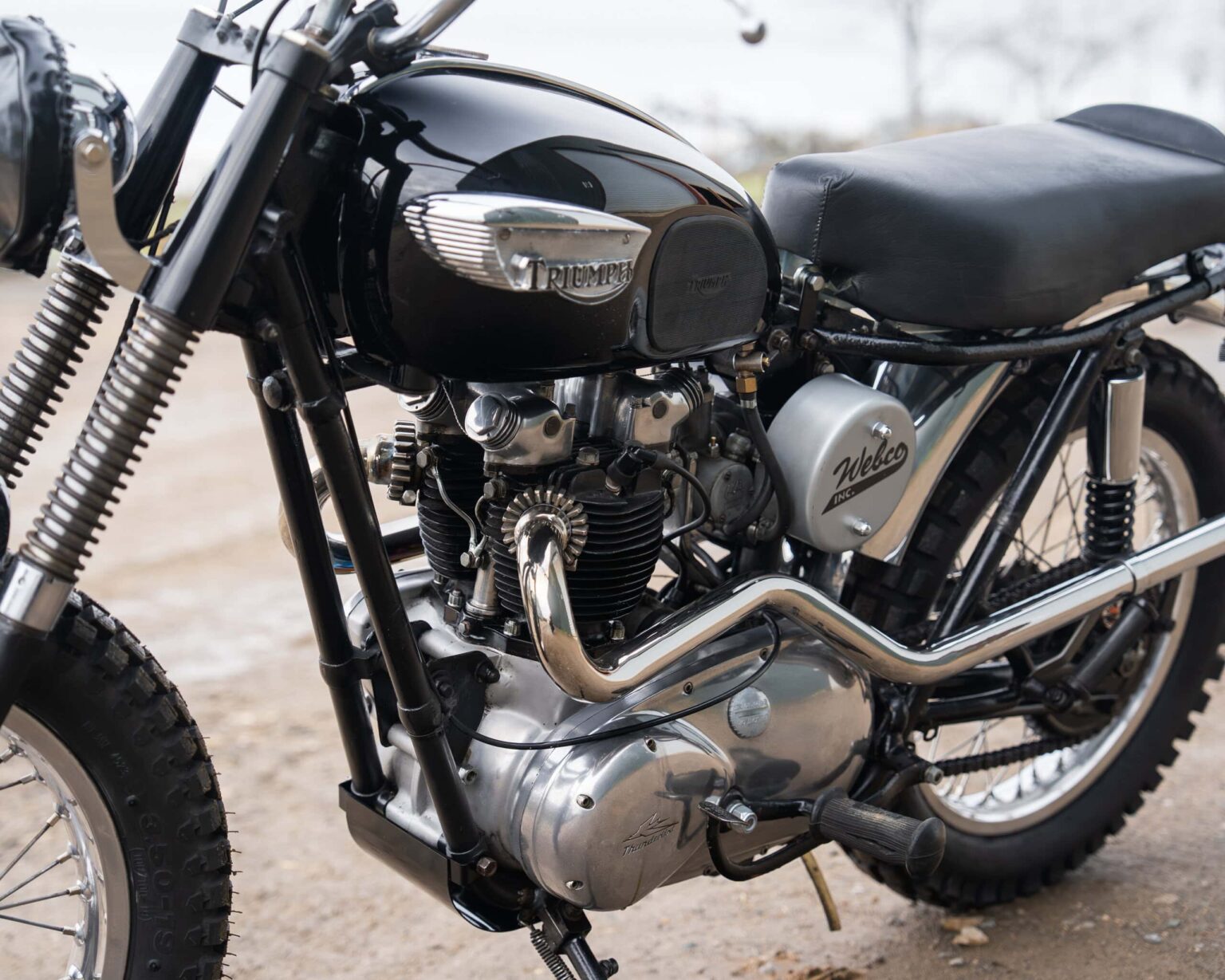 Triumph vintage motorcycle with black and chrome finish.
