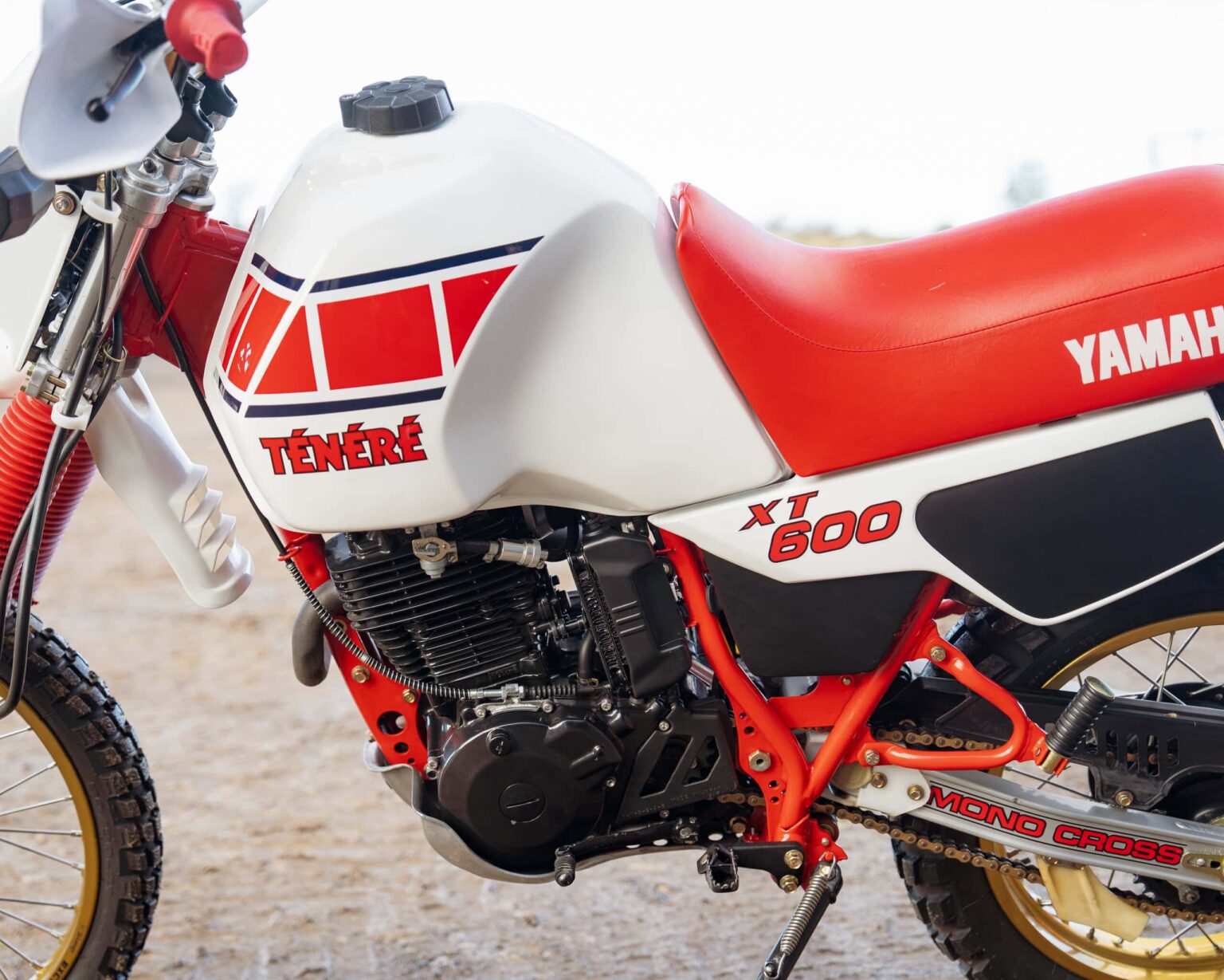 Classic Yamaha Ténéré XT 600 off-road motorcycle with red and white design.