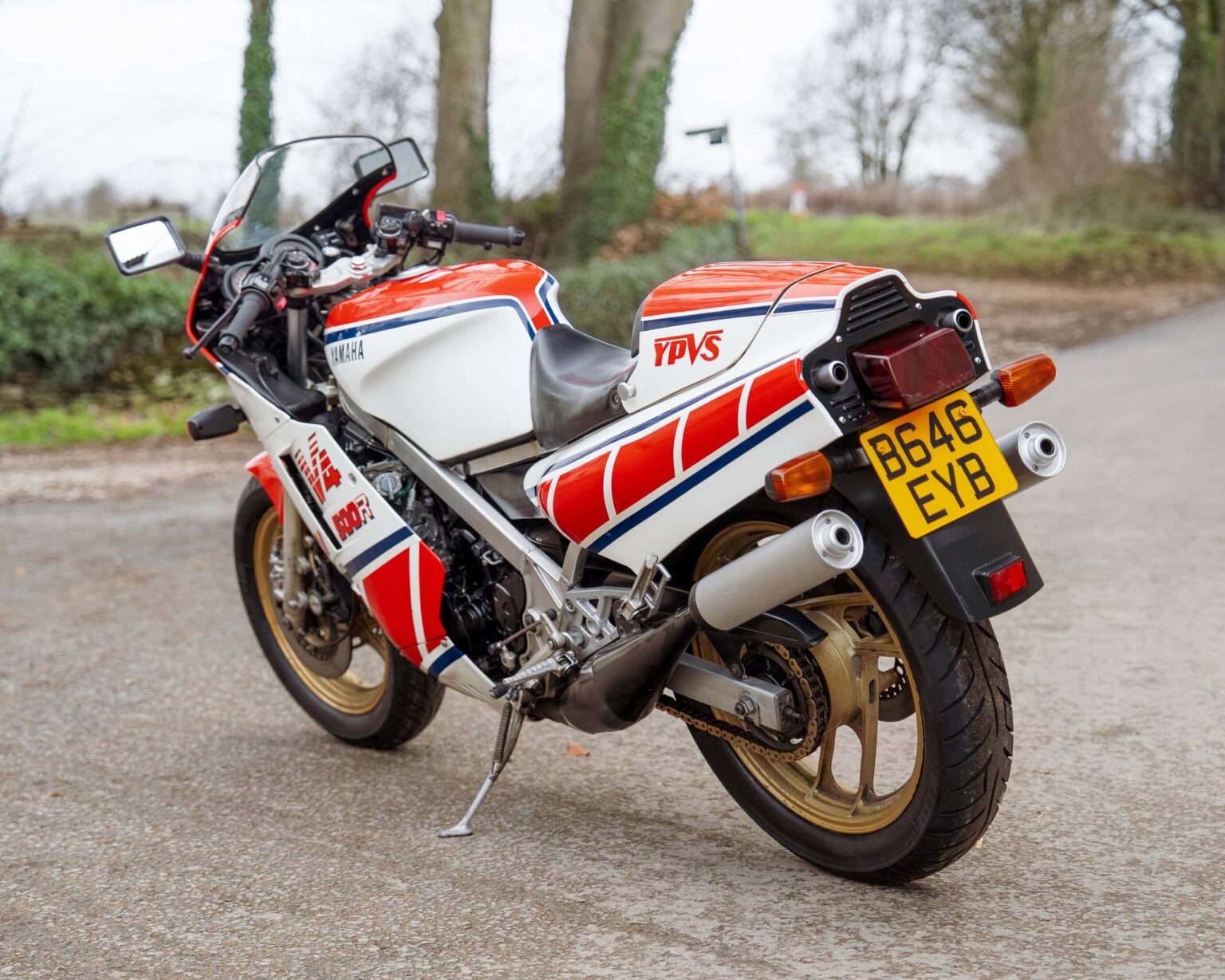 Yamaha YPVS racing motorcycle with vintage design and racing decals.