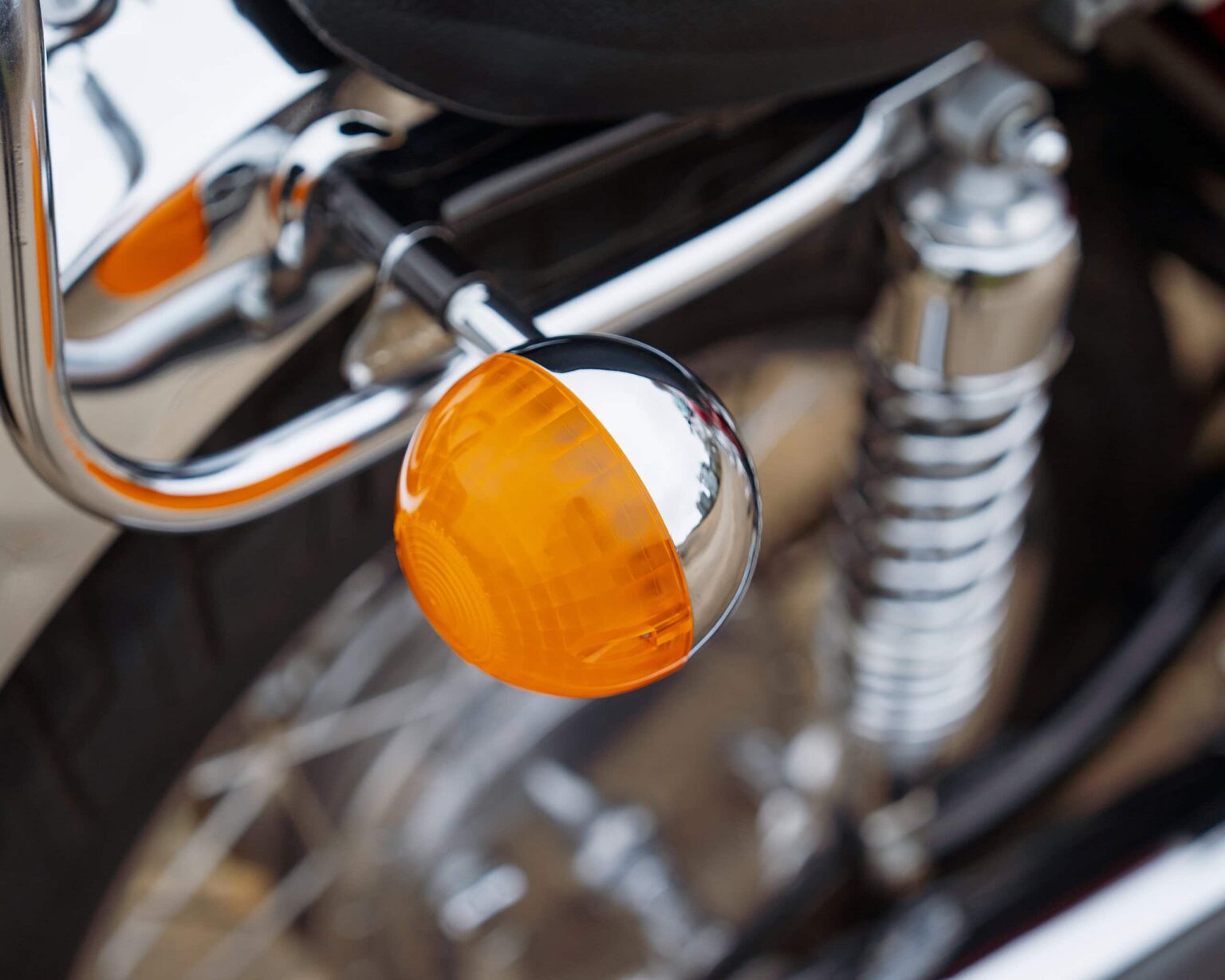 Turn signal indicator on a classic motorcycle.