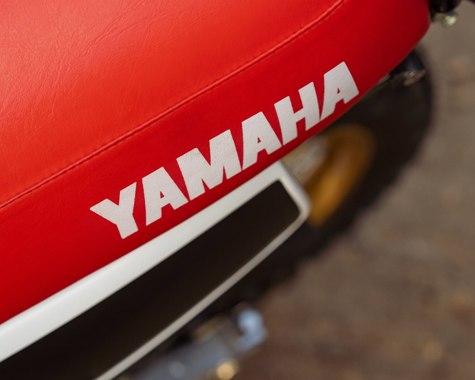 Yamaha logo on a red motorcycle seat.