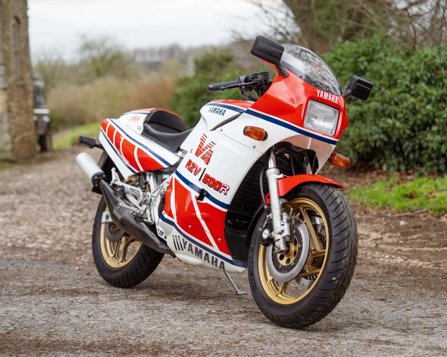 Yamaha RD5002 vintage racing motorcycle with iconic red, white, and blue racing livery.