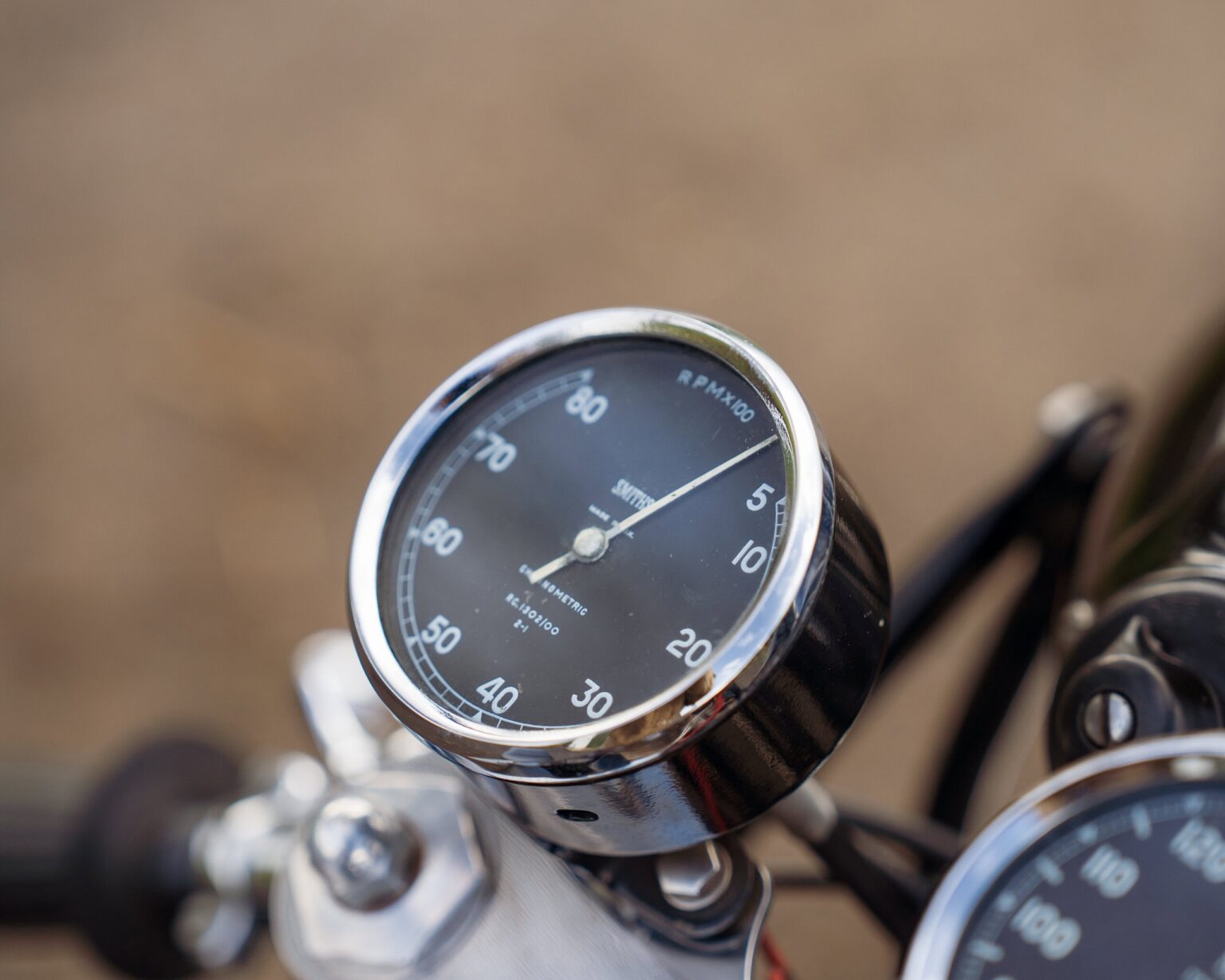Speedometer gauge on a vintage motorcycle.
