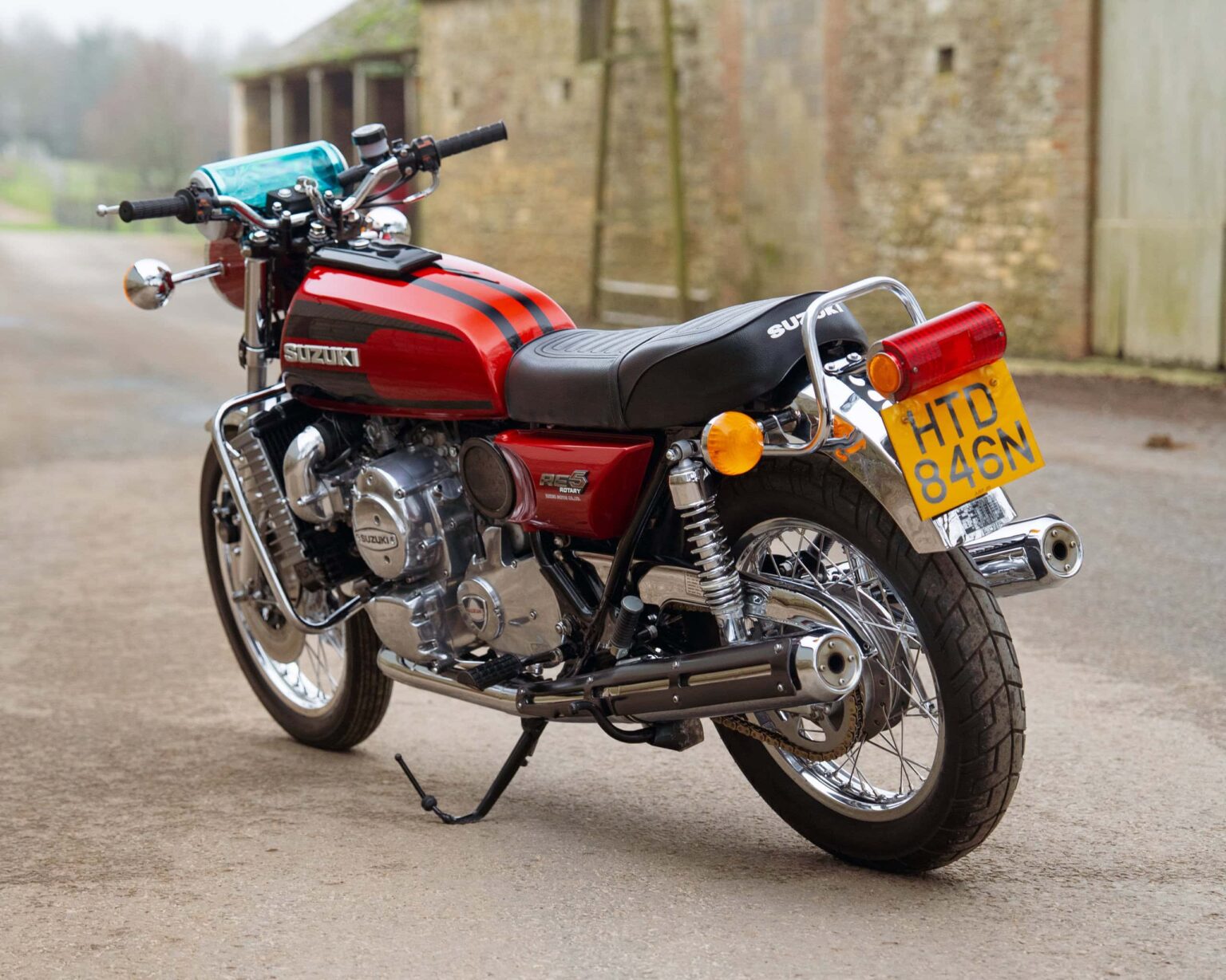 Classic Suzuki motorcycle with vintage design and red and black colour scheme.