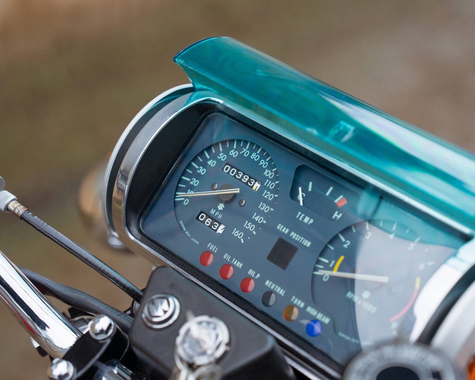 Motorcycle speedometer and gauges close-up.