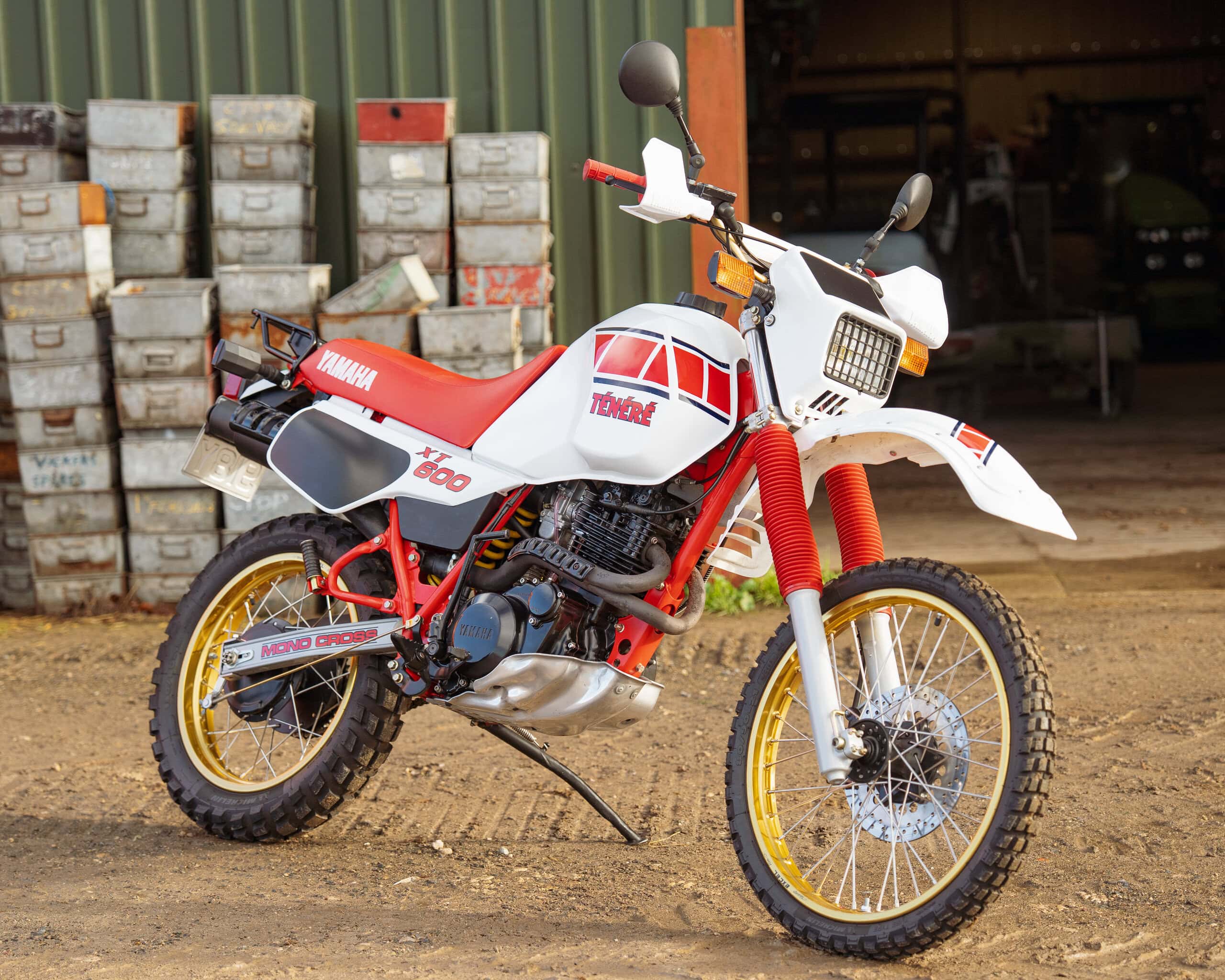 Yamaha TT600 enduro motorcycle with red and white racing livery, off-road tyres, and rugged design.