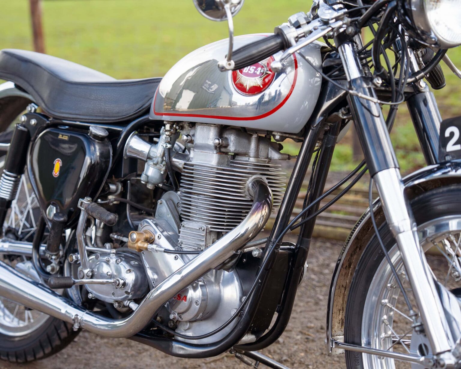 Vintage motorcycle with chrome details and retro design.
