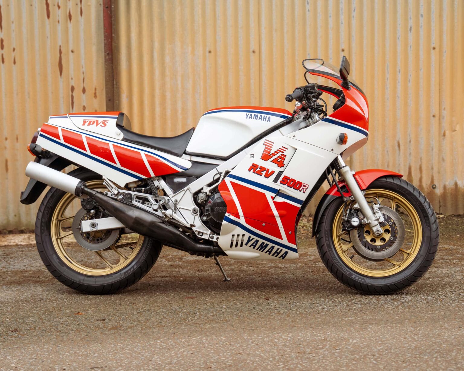 Yamaha V4 RCV 1000 racing motorcycle with red, white, and blue livery.