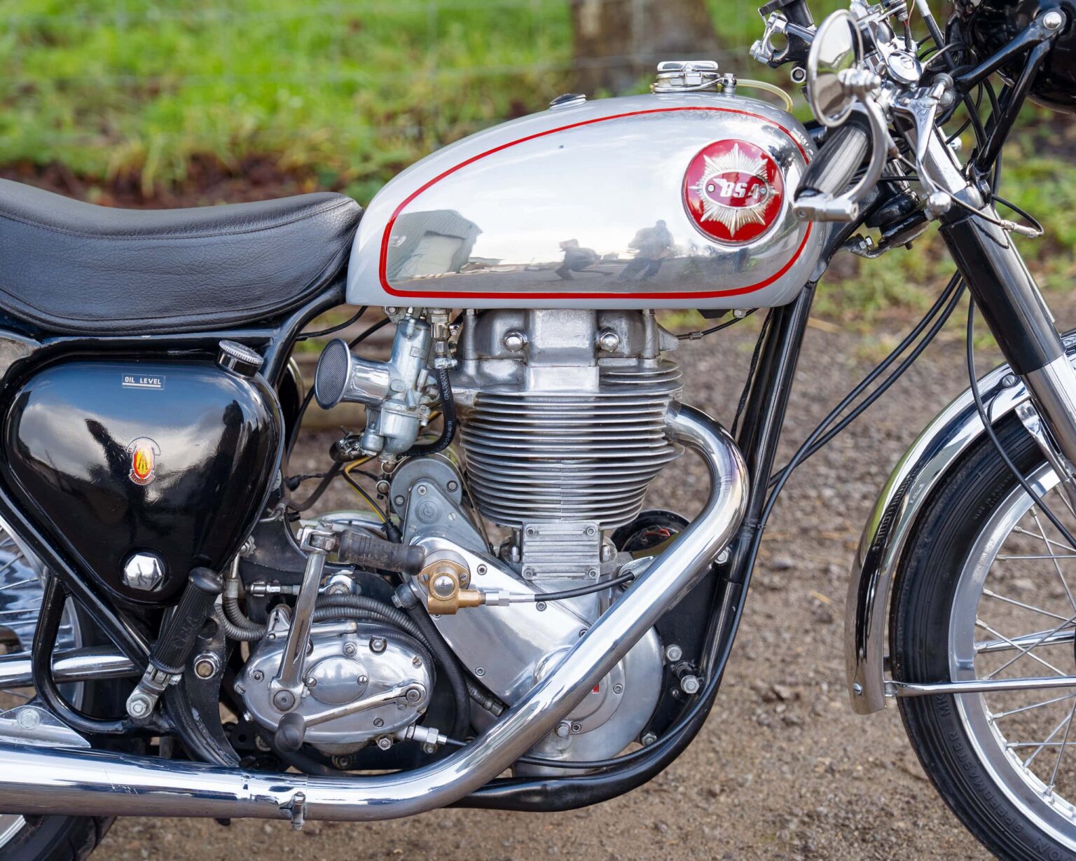 Classic motorcycle engine and fuel tank for vintage bike enthusiasts.