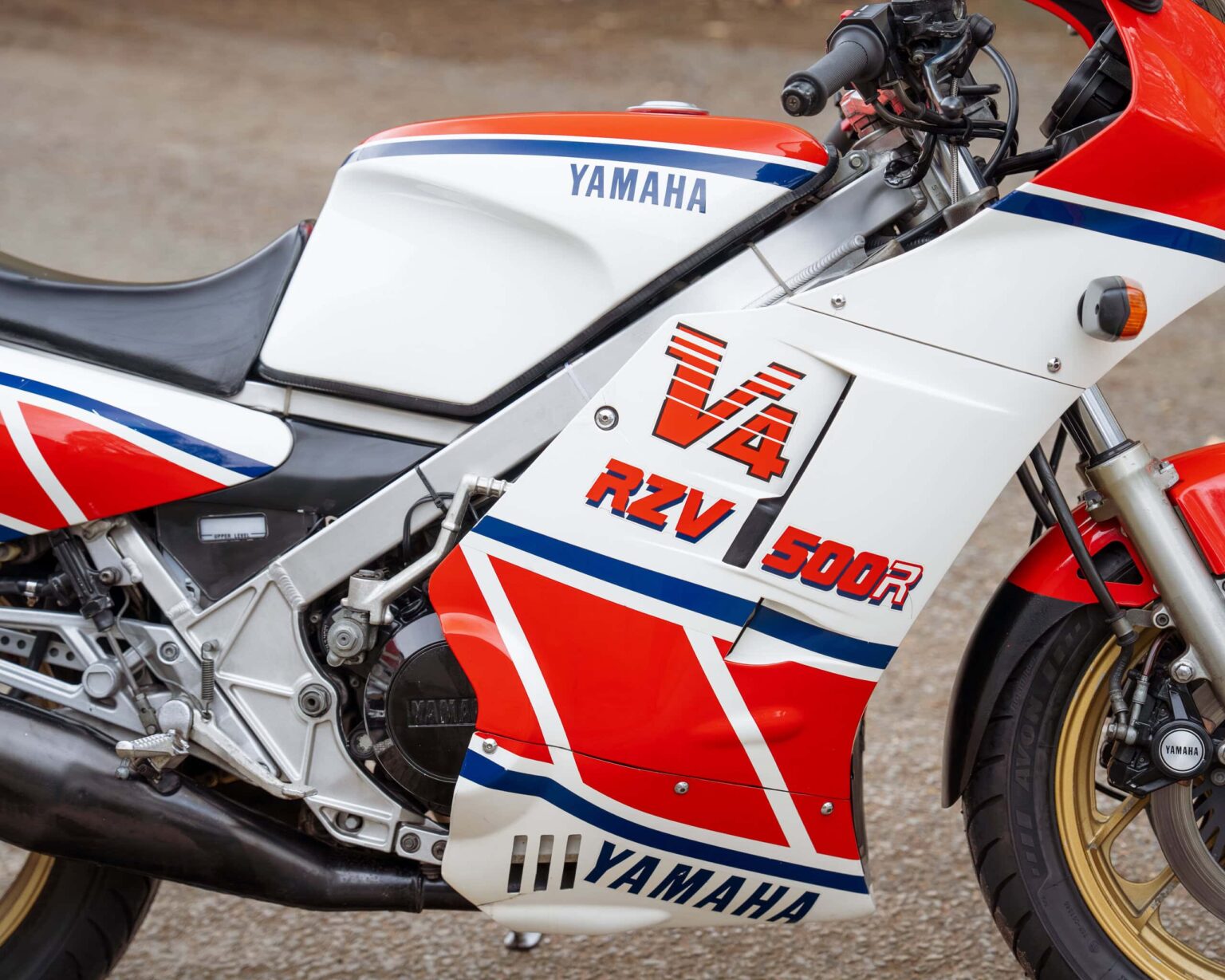 Yamaha RZV 500R racing motorcycle with iconic red, white, and blue livery.