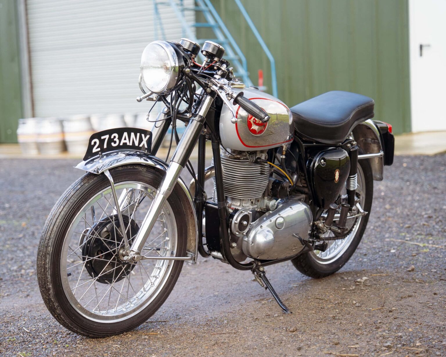 Vintage motorcycle with chrome details and black seat.